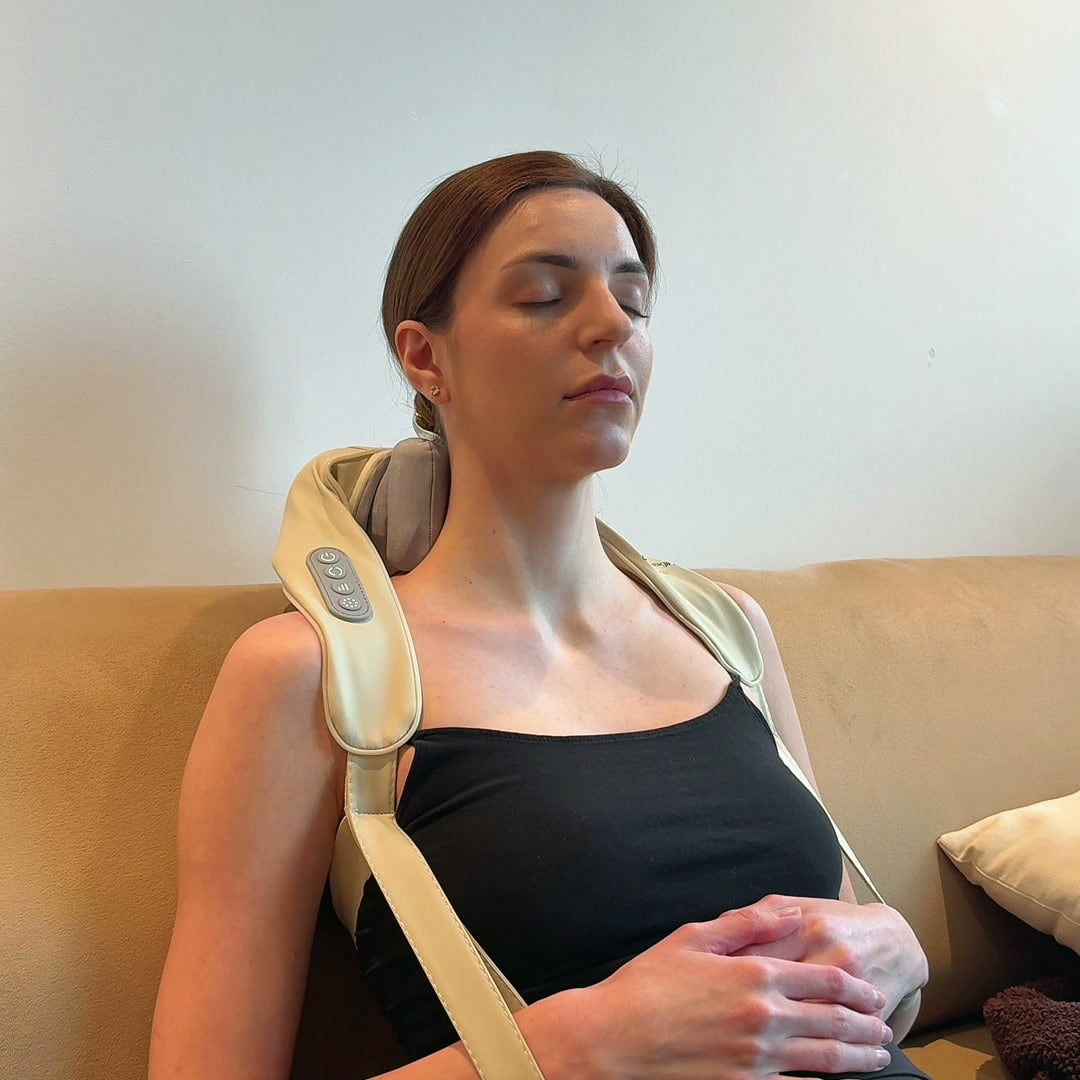 Lymphatic Transformation System - Woman relaxing on couch with neck massager