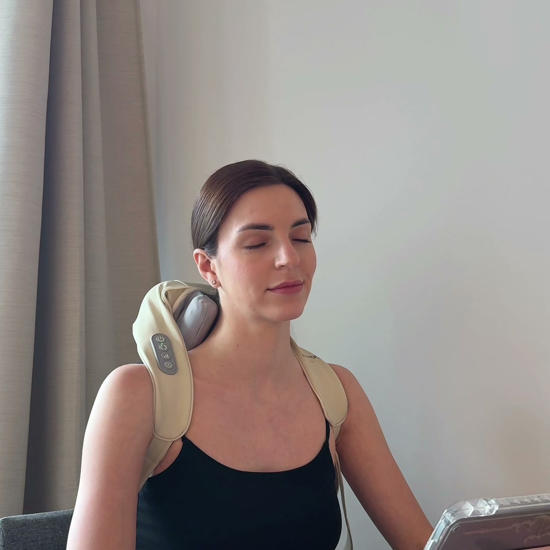 Using the Spark Imagine neck massager while working at desk